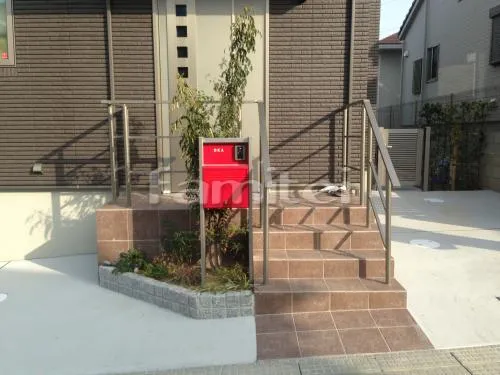 富田林市 新築オープン外構 システム機能門柱 ポスティモα ピンコロ石花壇