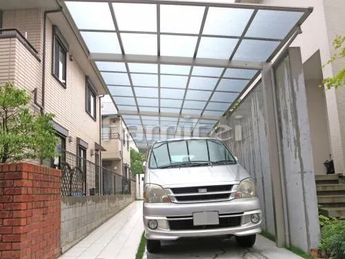 吹田市 外構工事 玄関まわり 石柱 門柱 アプローチ 芝生 ガレージまわり 駐車場屋根 土間コンクリート お庭 芝生張り 姫高麗芝 犬走り 防犯砂利敷き バラス砕石