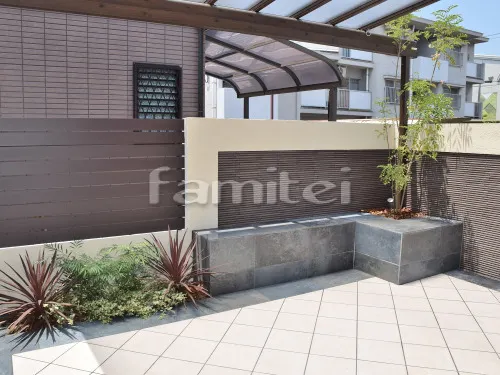 堺市西区 リフォーム外構工事 タイルデッキ フル木製調テラス屋根(パーゴラ風) ポイント植栽 木製調目隠しフェンス塀 塗り壁 ベルアート お庭 本物そっくり人工芝 タイルベンチ ニッタイ工業 ボルカーノ300角 お庭照明 TAKASHOタカショー パワーLEDウォールライト2型 スポットライト1型 セキスイエクステリア ゼロフランジ シルバー ガーデンライティング ライト照明