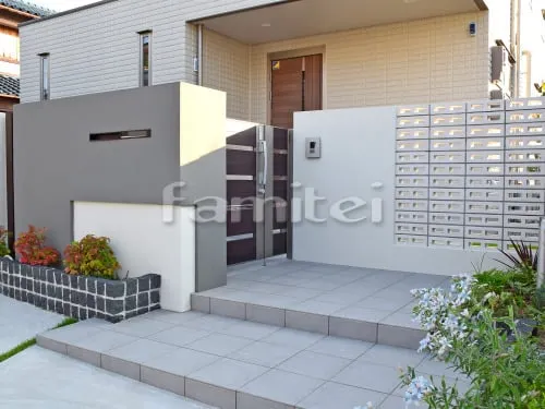 泉佐野市 外構工事 新築シンプルモダン セミクローズ外構 玄関まわり 門袖 目隠し塀 門扉 アプローチ 花壇 ガレージまわり 駐車場屋根 門扉 土間コンクリート 車止め 境界フェンス塀 物置